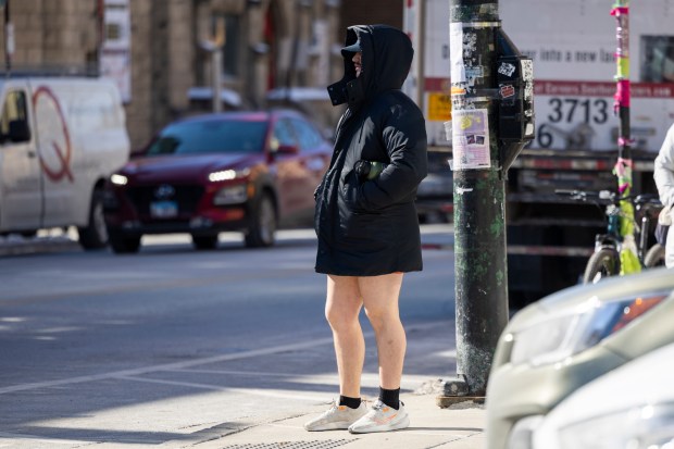 A person braves cold temperatures as he waits at the corner of Belmont Avenue and Broadway in Lake View on Feb. 18, 2025. (Eileen T. Meslar/Chicago Tribune)