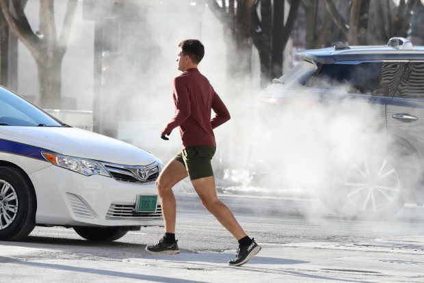 Pedestrians brave the bitterly cold, single digit temperatures as they make their way along downtown Chicago, on Feb. 17, 2025. (Antonio Perez/Chicago Tribune)