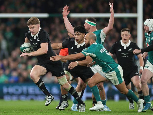 Jordie Barrett of the New Zealand All Blacks gets away from Jamison Gibson-Park during the Autumn Nations Series 2024 match between Ireland and the New Zealand All Blacks at Aviva Stadium on Nov. 8, 2024, in Dublin, Ireland. (David Rogers/Getty)