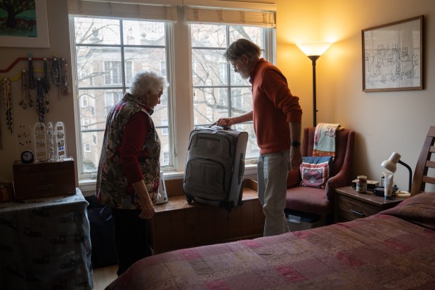 Clint Seely finishes packing for their quick trip to Door County, Wisconsin, to watch the Super Bowl, on Feb. 9, 2025. He lives in Door County six months of the year but lived there full time before meeting Sanna Longden. The couple wanted to watch the game with their friends up north. (Audrey Richardson/Chicago Tribune)