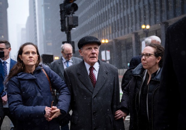 Former Illinois Speaker of the House Michael Madigan, flanked by daughters Nicole, left, and Tiffany, leaves the Dirksen U.S. Courthouse after jurors found him guilty on 10 counts in his racketeering case on Feb. 12, 2025. (E. Jason Wambsgans/Chicago Tribune)