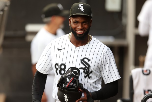 Chicago White Sox center fielder Luis Robert Jr. (88) flashes a smile in the dugout before the start of a game against the Los Angeles Dodgers at Guaranteed Rate Field in Chicago on June 25, 2024. (Chris Sweda/Chicago Tribune)