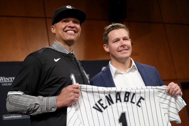 Chicago White Sox new manager Will Venable, and White Sox General Manager Chris Getz holds up Venable's White Sox jersey during a press conference at Guaranteed Rate Field in Chicago, Friday, Nov. 8, 2024. (Antonio Perez/Chicago Tribune)