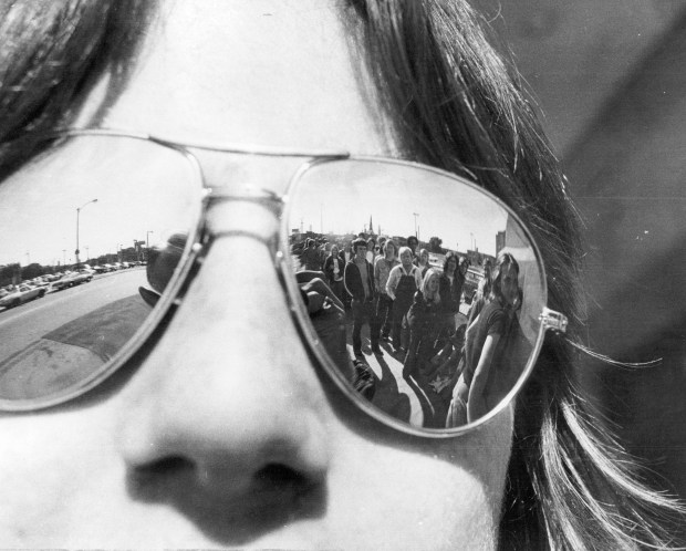 With a long line of fans mirrored in his sunglasses, Perry Dunne waits his turn outside Chicago Stadium on June 3, 1977, to buy tickets to the August concert of Led Zeppelin. (Roy Hall/Chicago Tribune)