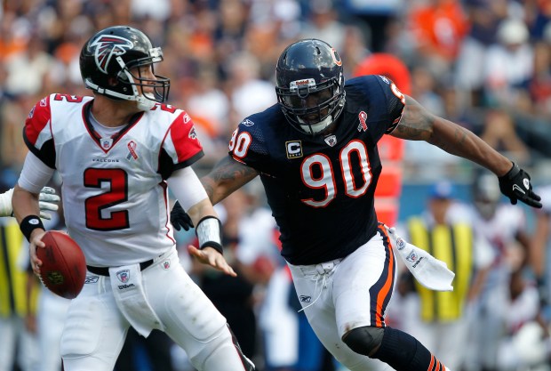 Bears defensive end Julius Peppers pressures Falcons quarterback Matt Ryan and forces a fumble on Sept. 11, 2011, at Soldier Field. (José M. Osorio/Chicago Tribune)