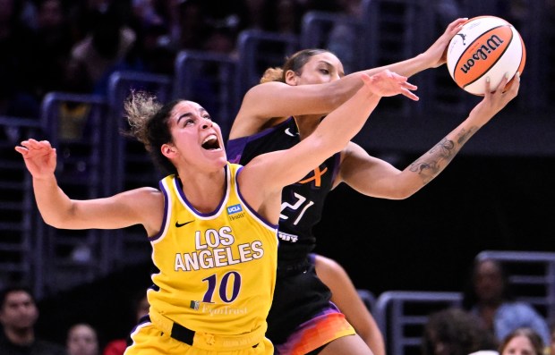 The Sparks' Kia Nurse and Mercury's Herbert Harrigan reach for the loose ball in the second half on Sept. 17, 2024. (Photo by Keith Birmingham, Orange County Register/ SCNG)