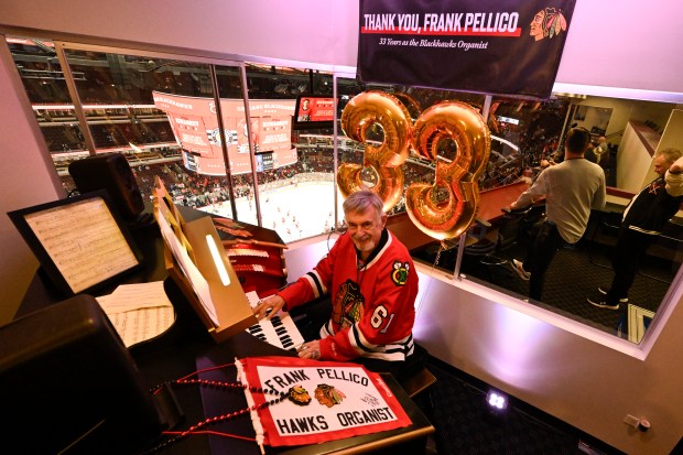 Frank Pellico, the Chicago Blackhawks' organist, is seen in his booth before the first period of an NHL hockey game against the Toronto Maple Leafs, Sunday, Feb. 23, 2025, in Chicago. He is retiring after the game. (AP Photo/Matt Marton)