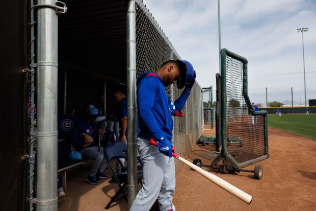 Cubs outfielder Alexander Canario walks to the field before hitting at live batting practice during spring training on Feb. 13, 2025, at Sloan Park in Mesa, Ariz. (Armando L. Sanchez/Chicago Tribune)