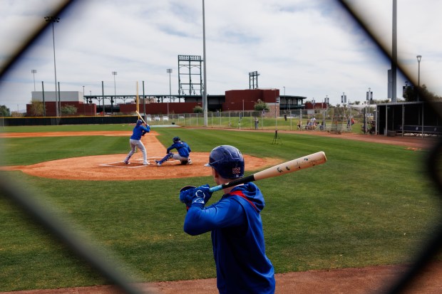 Cubs center fielder Pete Crow-Armstrong waits to hit while pitcher Justin Steele throws to outfielder Alexander Canario at live batting practice during spring training on Feb. 13, 2025, at Sloan Park in Mesa, Ariz. (Armando L. Sanchez/Chicago Tribune)