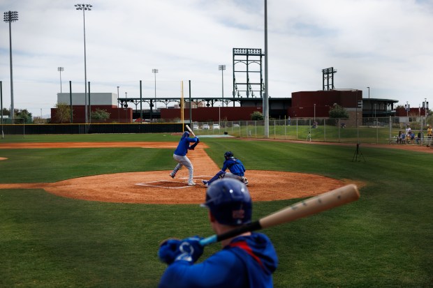 Cubs center fielder Pete Crow-Armstrong waits to hit while pitcher Justin Steele throws to outfielder Alexander Canario at live batting practice during spring training on Feb. 13, 2025, at Sloan Park in Mesa, Ariz. (Armando L. Sanchez/Chicago Tribune)