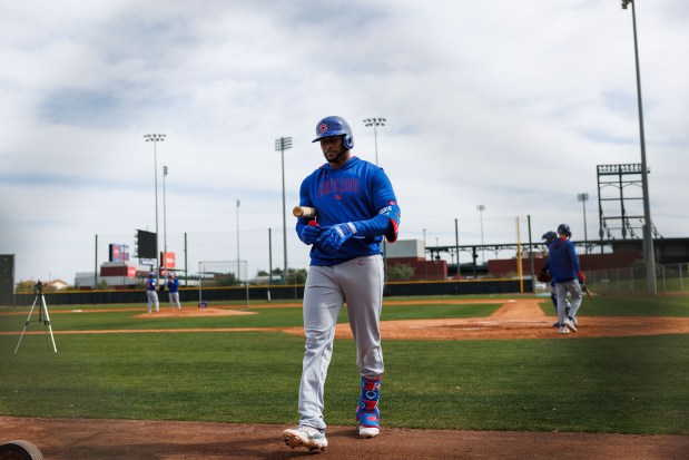 Cubs outfielder Alexander Canario walks to the side of a practice field after hitting at live batting practice during spring training on Feb. 13, 2025, at Sloan Park in Mesa, Ariz. (Armando L. Sanchez/Chicago Tribune)