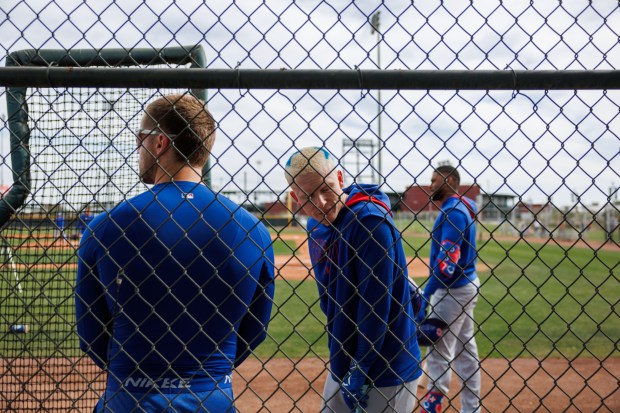 Cubs center fielder Pete Crow-Armstrong, left, talks with infielder Nico Hoerner during spring training on Feb. 13, 2025, at Sloan Park in Mesa, Ariz. (Armando L. Sanchez/Chicago Tribune)