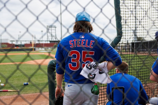 Cubs pitcher Justin Steele stands near the side of a practice field after throwing at live batting practice during spring training on Feb. 13, 2025, at Sloan Park in Mesa, Ariz. (Armando L. Sanchez/Chicago Tribune)