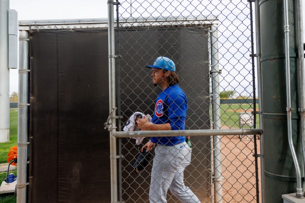 Cubs pitcher Justin Steele walks off a practice field after throwing at live batting practice during spring training on Feb. 13, 2025, at Sloan Park in Mesa, Ariz. (Armando L. Sanchez/Chicago Tribune)