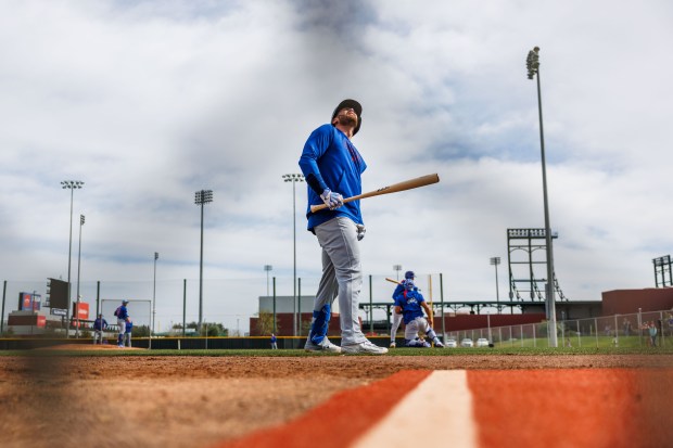 Cubs catcher Carson Kelly waits to hit at live batting practice during spring training on Feb. 13, 2025, at Sloan Park in Mesa, Ariz. (Armando L. Sanchez/Chicago Tribune)