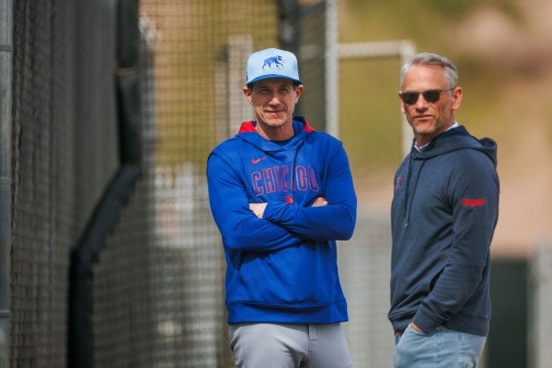 Cubs manager Craig Counsell talks with President Jed Hoyer during spring training at Sloan Park on Feb. 16, 2025, in Mesa, Ariz. (Armando L. Sanchez/Chicago Tribune)