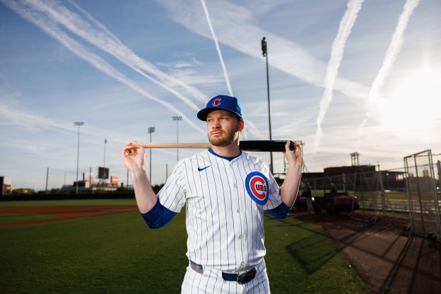 Chicago Cubs outfielder Ian Happ stands with his bat on media day during spring training at Sloan Park, Feb. 17, 2025, in Mesa, Ariz. (Armando L. Sanchez/Chicago Tribune)