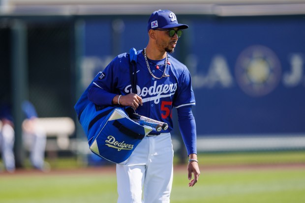 Los Angeles Dodgers shortstop Mookie Betts (50) walks on the field before playing the Chicago Cubs during spring training at Camelback Ranch Thursday Feb. 20, 2025, in Glendale, Arizona. (Armando L. Sanchez/Chicago Tribune)