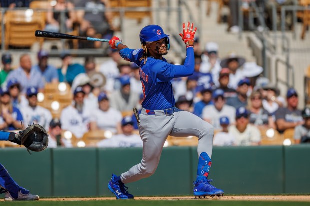 Chicago Cubs outfielder Kevin Alcántara (13) hits a single during the first inning against the Los Angeles Dodgers at spring training at Camelback Ranch Thursday Feb. 20, 2025, in Glendale, Arizona. (Armando L. Sanchez/Chicago Tribune)