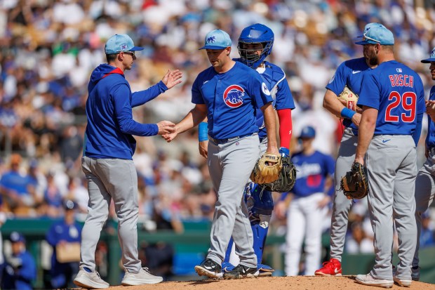 Chicago Cubs manager Craig Counsell (11) takes out Chicago Cubs pitcher Cody Poteet (38) during the second inning against the Los Angeles Dodgers at spring training at Camelback Ranch Thursday Feb. 20, 2025, in Glendale, Arizona. (Armando L. Sanchez/Chicago Tribune)