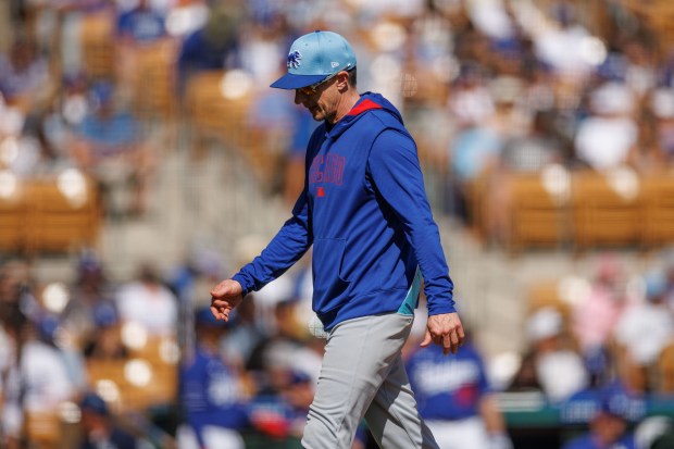 Chicago Cubs manager Craig Counsell (11) walks to the dugout after taking out Chicago Cubs pitcher Cody Poteet (38) during the second inning against the Los Angeles Dodgers at spring training at Camelback Ranch Thursday Feb. 20, 2025, in Glendale, Arizona. (Armando L. Sanchez/Chicago Tribune)