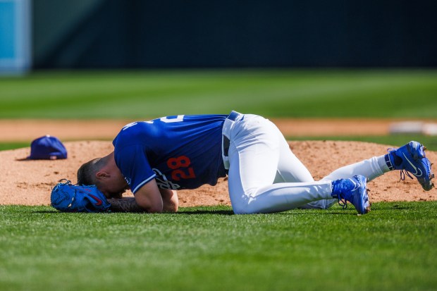 Los Angeles Dodgers pitcher Bobby Miller (28) gets hit by a pitch from Chicago Cubs first base Michael Busch (29) during the third inning at spring training at Camelback Ranch Thursday Feb. 20, 2025, in Glendale, Arizona. (Armando L. Sanchez/Chicago Tribune)