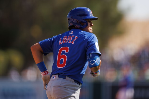 Chicago Cubs short stop Nicky Lopez gets walked during the third inning against the Los Angeles Dodgers at spring training at Camelback Ranch Thursday Feb. 20, 2025, in Glendale, Arizona. (Armando L. Sanchez/Chicago Tribune)