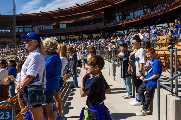 Fans stand for the national anthem before the Chicago Cubs play the Los Angeles Dodgers at spring training at Camelback Ranch Thursday Feb. 20, 2025, in Glendale, Arizona. (Armando L. Sanchez/Chicago Tribune)