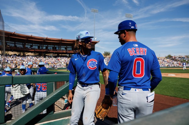 Chicago Cubs outfielder Kevin Alcántara (13) talks with Chicago Cubs third base coach Quintin Berry (0) after the second inning against the Los Angeles Dodgers at Camelback Ranch Thursday Feb. 20, 2025, in Glendale, Arizona. (Armando L. Sanchez/Chicago Tribune)