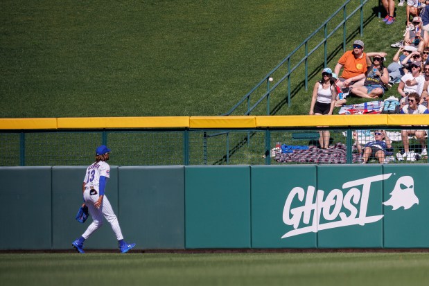 Cubs center fielder Kevin Alcántara watches a double from White Sox center fielder Luis Robert Jr. bounce over the fence during the third inning on Feb. 22, 2025, at Sloan Park in Mesa, Arizona. (Armando L. Sanchez/Chicago Tribune)