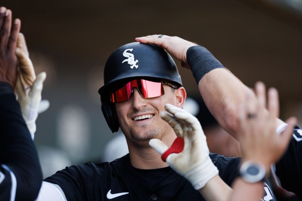 White Sox shortstop Colson Montgomery celebrates in the dugout after hitting a home run in the fourth inning against the Cubs on Feb. 22, 2025, at Sloan Park in Mesa, Ariz. (Armando L. Sanchez/Chicago Tribune)