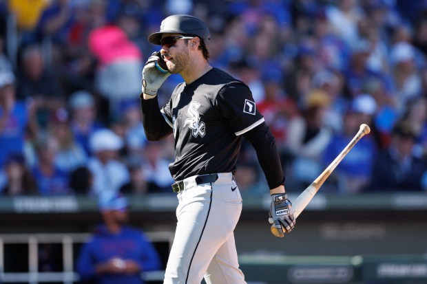 Chicago White Sox outfielder Mike Tauchman (18) walks to the dugout after being stuck out during the fourth inning against the Chicago Cubs at spring training at Sloan Park Saturday Feb. 22, 2025, in Mesa, Arizona. (Armando L. Sanchez/Chicago Tribune)