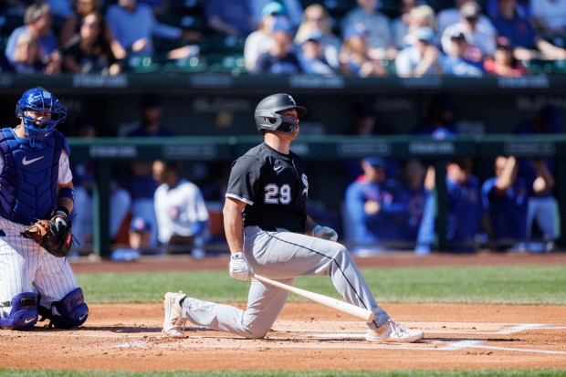 White Sox catcher Matt Thaiss drops to a knee after hitting a foul ball in the first inning against the Cubs during a Cactus League game at Sloan Park on Feb. 22, 2025, in Mesa, Ariz. (Armando L. Sanchez/Chicago Tribune)