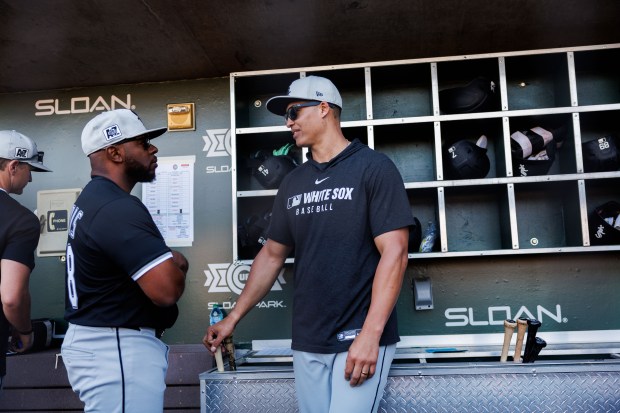 White Sox manager Will Venable, right, stands in the dugout before a Cactus League game against the Cubs at Sloan Park on Feb. 22, 2025, in Mesa, Ariz. (Armando L. Sanchez/Chicago Tribune)