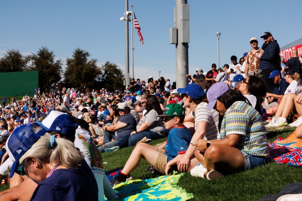 Fans sit behind the outfield during the seventh inning while the Chicago Cubs play the Chicago White Sox at spring training at Sloan Park Saturday Feb. 22, 2025, in Mesa, Arizona. (Armando L. Sanchez/Chicago Tribune)