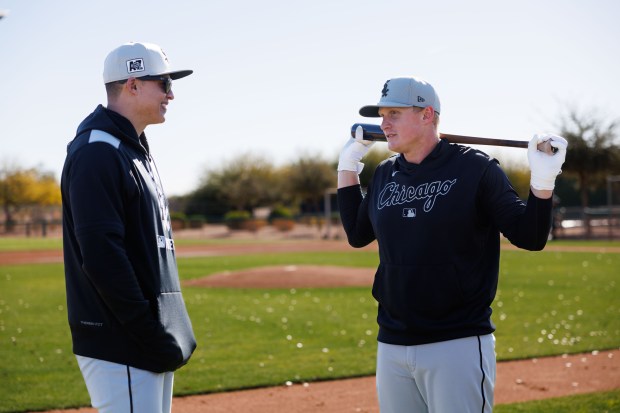 Chicago White Sox manager Will Venable talks with Chicago White Sox infielder Andrew Vaughn during spring training at Camelback Ranch Saturday Feb. 15, 2025, in Glendale, Ariz.(Armando L. Sanchez/Chicago Tribune)