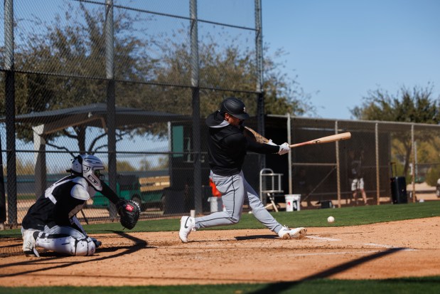 White Sox catcher Korey Lee hits during live batting practice at spring training at Camelback Ranch on Feb. 15, 2025, in Glendale, Ariz. (Armando L. Sanchez/Chicago Tribune)