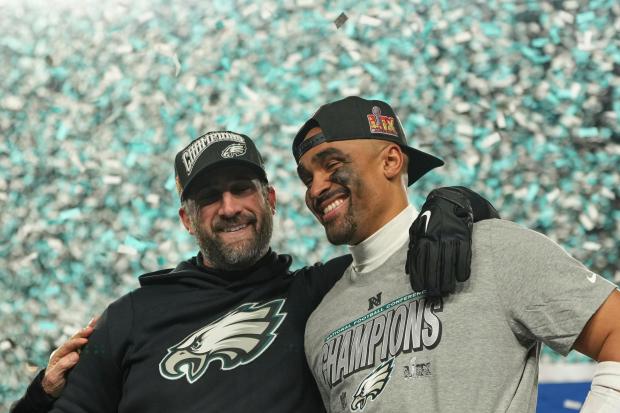 Philadelphia Eagles coach Nick Sirianni, left, quarterback Jalen Hurts celebrate after the Eagles won the NFC Championship NFL football game against the Washington Commanders, Sunday, Jan. 26, 2025, in Philadelphia. (AP Photo/Matt Slocum)