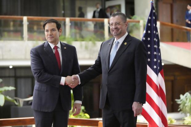 Secretary of State Marco Rubio, left, shakes hands with Costa Rican President Rodrigo Chaves during a joint news conference at the presidential palace in San Jose, Costa Rica, Tuesday, Feb. 4, 2025. (AP Photo/Mark Schiefelbein, Pool)