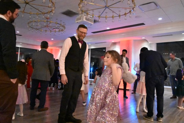  Ian Miller and daughter Saoirse Miller cut a rug Feb. 8, 2025 at the annual "Little Ladies Winter Dance" held at the Howard Leisure Center in Niles. (Jesse Wright/for Pioneer Press)