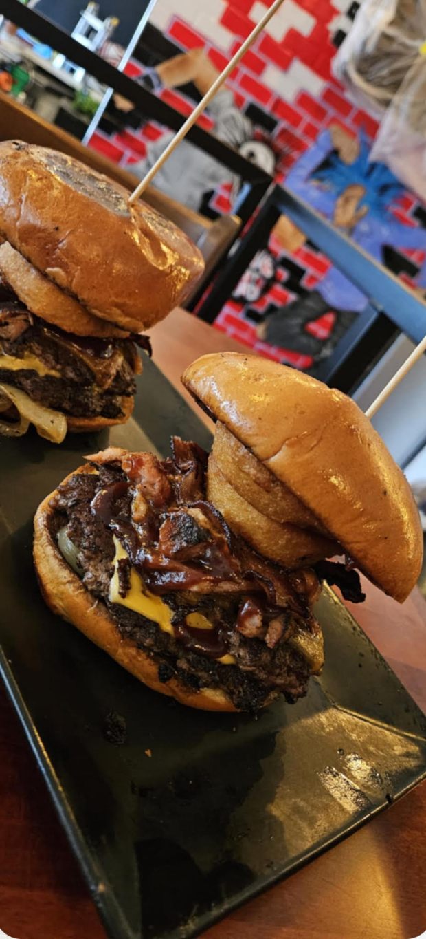 "The Gavinator," featuring two quarter-pound beef patties, smoked pulled pork, bacon, American cheese, pickles, grilled onions, onion rings, barbecue sauce and Dusseldorf mustard aioli, will be one of the featured menu options at Legit Dogs & Ice when it opens in South Elgin in March, owner Matt Habib said. (Matt Habib)