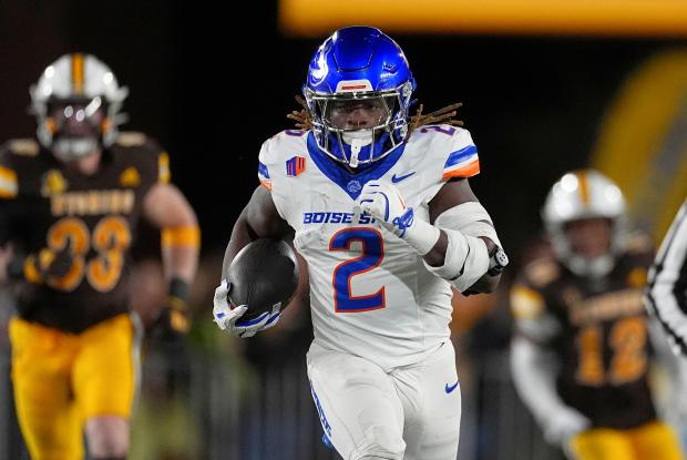 Boise State running back Ashton Jeanty runs against Wyoming on Nov. 23, 2024, in Laramie, Wyo. (AP Photo/David Zalubowski)