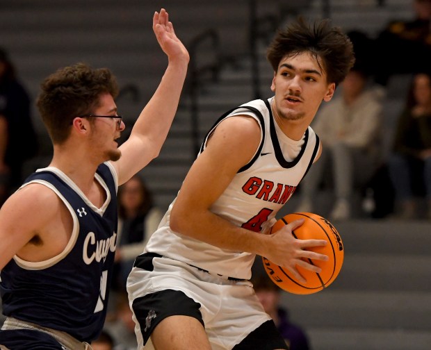 Clinton's Blaine Brown (34) defends against Grant's Charles Schlicht (4) Grant's boys basketball team had to overcome a 17 point half-time deficit to beat Clinton (Wisconsin) 73-68 in Fox Lake, Monday, Jan. 6, 2025. (Rob Dicker / for the News Sun)