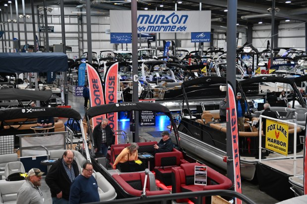 Below, in orange shirt is Colleen Scheitz of Ringwood at the Northern Illinois Boat Show on opening day, Feb. 27, 2025 at the Lake County Fairgrounds (1060 E. Peterson Road) in Grayslake. (Karie Angell Luc/Lake County News-Sun)