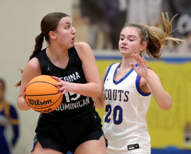 Lake Forest's Charlie Axus guards Regina Dominican's Anna O'Connor