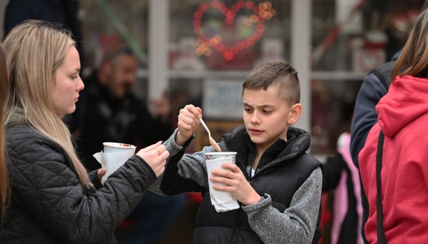 Center, with hot chocolate is Owen Russo, 11, a sixth-grader from Mount Prospect during the Cocoa Crawl in downtown Long Grove on Feb. 8, 2025. (Karie Angell Luc/Lake County News-Sun)