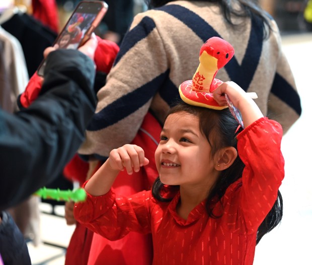 Laila Chovatiya, 5, of Highland Park, poses with her new stuffed toy with her mother Adelina Hung at the Lunar New Year Celebration at Hawthorn mall in Vernon Hills on Feb. 1, 2025. (Karie Angell Luc/Lake County News-Sun)