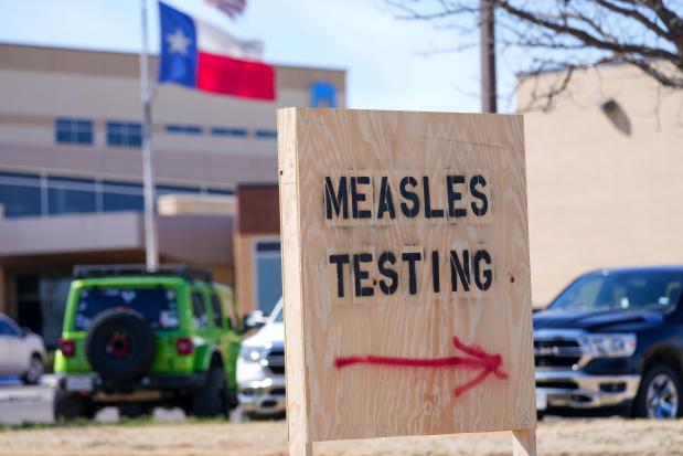 A sign is seen outside of Seminole Hospital District offering measles testing, Feb. 21, 2025, in Seminole, Texas. (AP Photo/Julio Cortez), File)