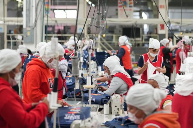 Employees work at a textile factory in Tlaxcala, Mexico, Tuesday, Feb. 4, 2025. (AP Photo/Eduardo Verdugo)