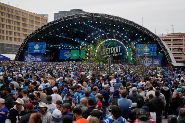 Crowds fill an area outside of the draft stage during the second round of the NFL draft on April 26, 2024, in Detroit. (AP Photo/Carlos Osorio)